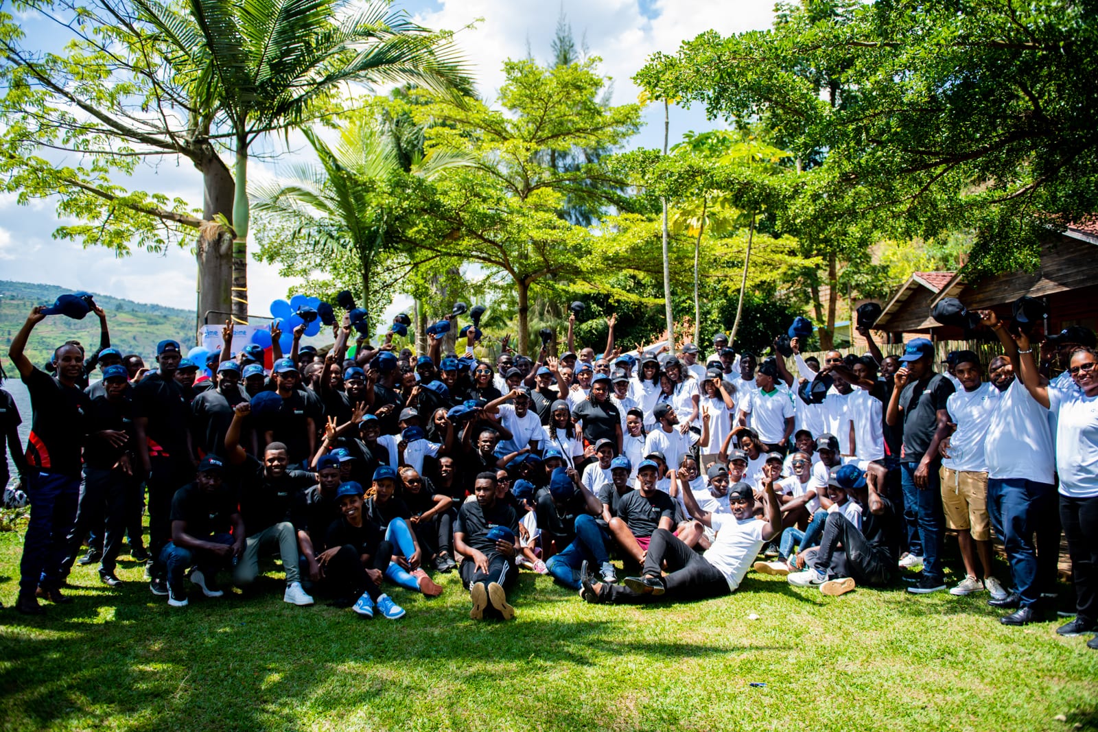 Cheering Rwandan youth crowd celebrating creative achievements in Kigali